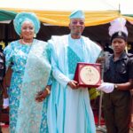Rtd. IGP Kayode Adeolu Egbetokun, flanked by his wife Mrs. Elizabeth Egbetokun (L) receives award from the students of Police Secondary School School, Erinja at the Welcome Home Celebration organized in his honour on Saturday, 18th April, 2026.